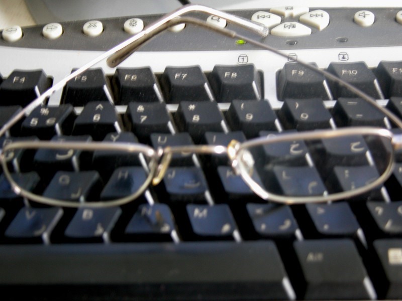 glasses on a keyboard