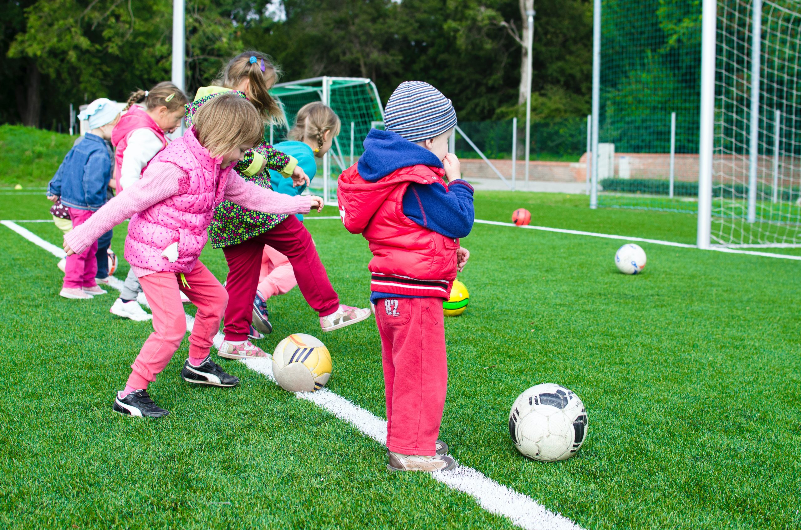 toddlers playing soccer