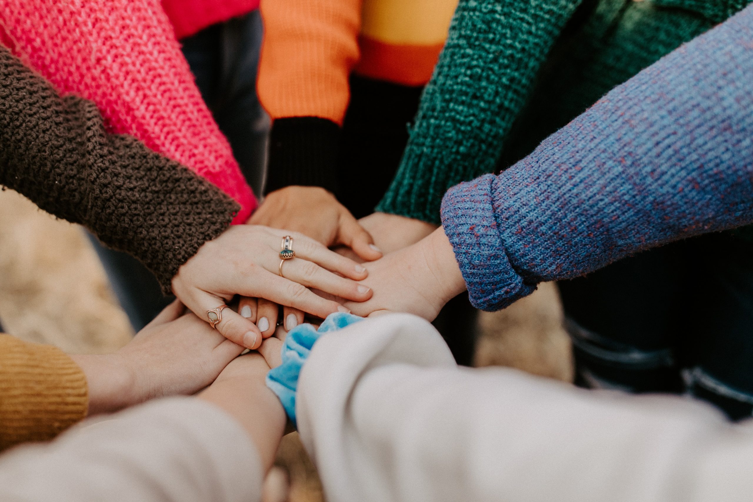 people pressing hands together