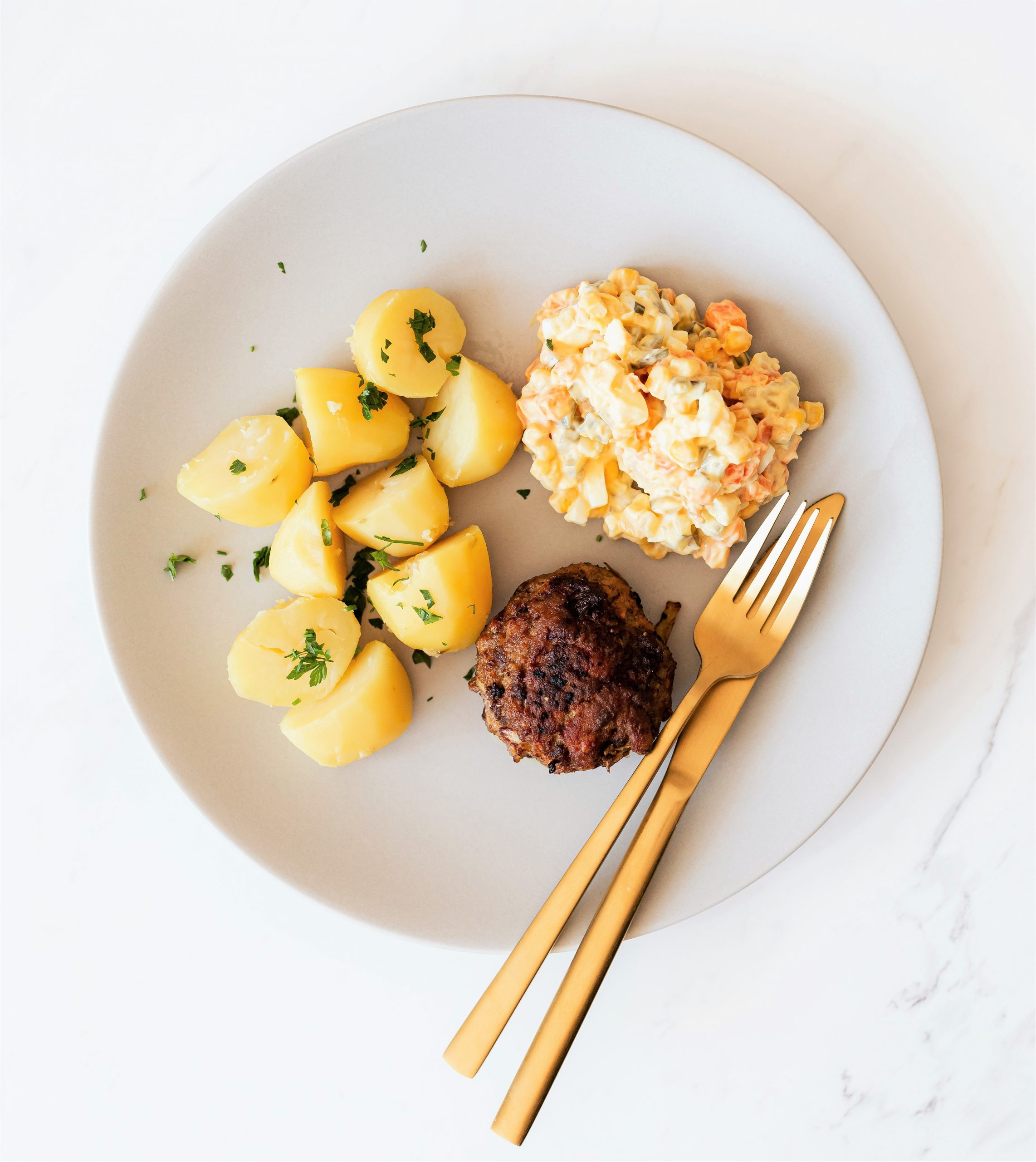 a plate of food with a fork and a knife