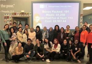 International Students Club doing community service at Feed My Starving Children