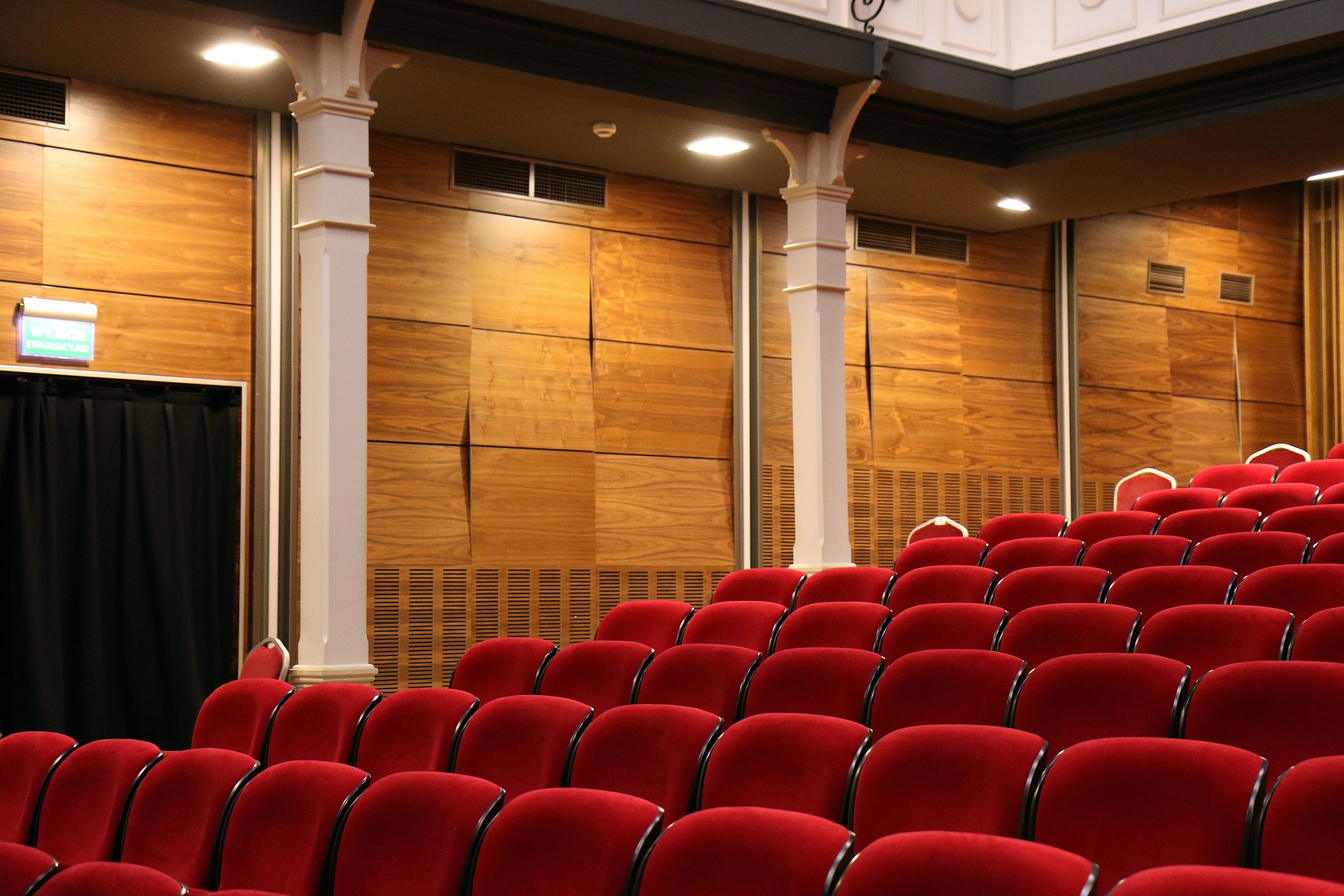 rows of red chairs in a theater