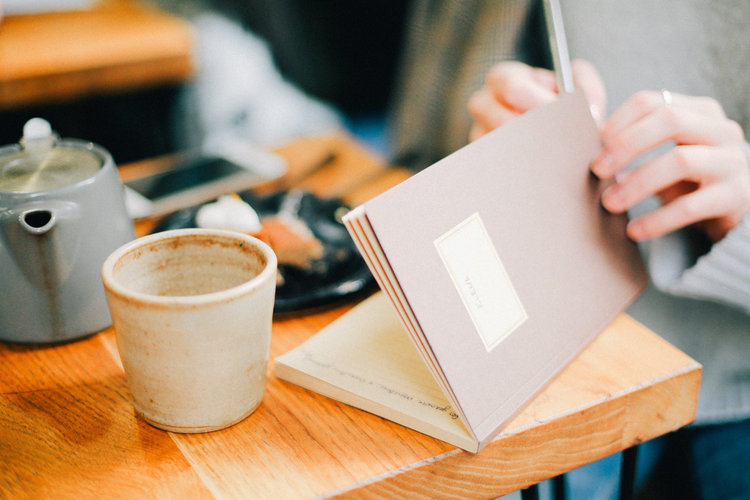 a person opening a diary