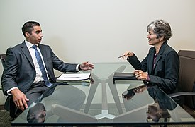 image of woman interviewing man