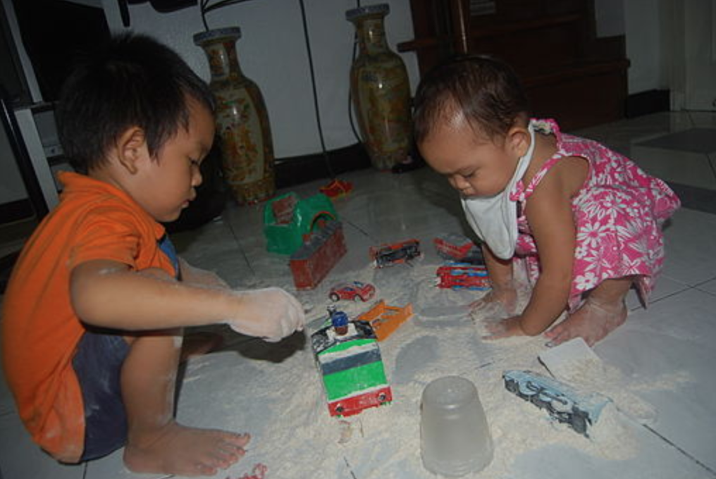 image of two children playing together