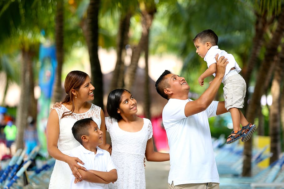 image of parents with three children