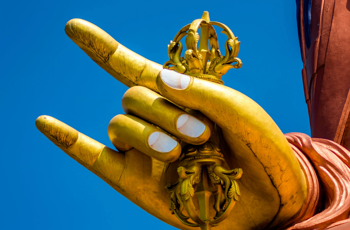 Photo of a Gold hand from a statue of Buddha