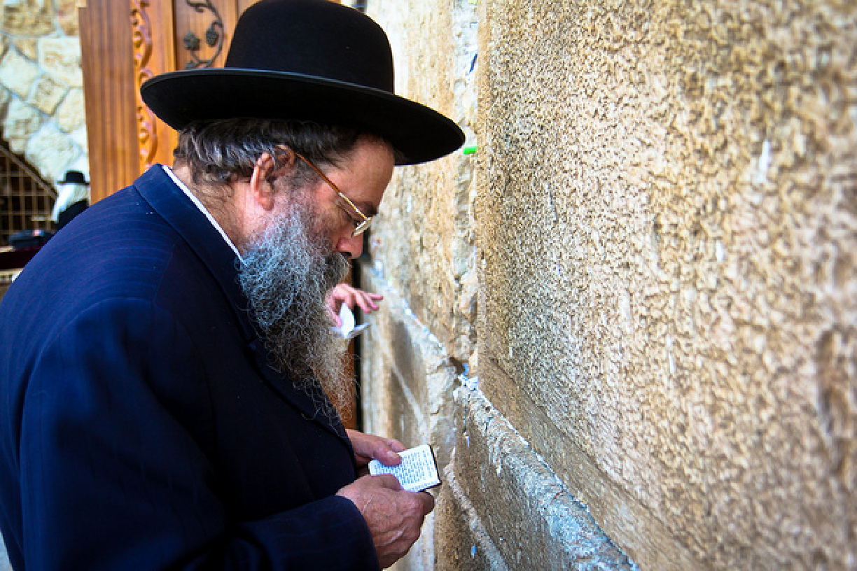 Photo of man worshipping at the Western Wall in Jerusalem