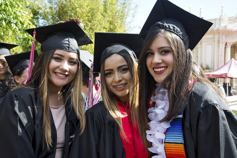 Photo of 3 women in graduation caps and gowns