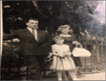 Picture of the LePine Family in 1952. Old White and black photo of a family posing outside in their Sunday's best